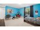 Bedroom with drum set, blue walls, and comfortable sleeping arrangements at 4934 Woodstream Nw Ln, Acworth, GA 30102