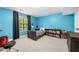 This bedroom has blue walls, carpet, and a window at 4934 Woodstream Nw Ln, Acworth, GA 30102