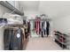 Organized walk-in closet with ample storage and shelving at 4934 Woodstream Nw Ln, Acworth, GA 30102