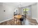 Cozy dining area features wood floors, natural light, and contemporary chandelier at 4934 Woodstream Nw Ln, Acworth, GA 30102