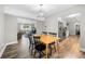 Inviting dining room adjacent to the kitchen with wood floors and modern lighting at 4934 Woodstream Nw Ln, Acworth, GA 30102