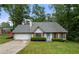 Charming single-story home with well-maintained lawn and a quaint, inviting exterior at 4934 Woodstream Nw Ln, Acworth, GA 30102
