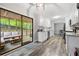 Modern kitchen with white cabinets, granite countertops, and a view of the screened porch at 4934 Woodstream Nw Ln, Acworth, GA 30102