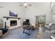 Bright living room with vaulted ceiling, fireplace, and open access to the dining area at 4934 Woodstream Nw Ln, Acworth, GA 30102