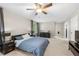 Spacious main bedroom with neutral tones, ceiling fan, and ensuite bathroom at 4934 Woodstream Nw Ln, Acworth, GA 30102