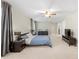 Spacious main bedroom with neutral tones, ceiling fan, and ensuite bathroom at 4934 Woodstream Nw Ln, Acworth, GA 30102