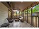 Relaxing screened-in porch with comfortable seating, perfect for enjoying the outdoors at 4934 Woodstream Nw Ln, Acworth, GA 30102