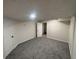 Finished basement featuring new carpet, recessed lighting, and freshly painted white walls at 600 Mary Erna Dr, Fairburn, GA 30213