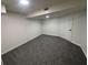 Finished basement with modern gray carpeting, recessed lighting, and white walls, perfect for extra living space at 600 Mary Erna Dr, Fairburn, GA 30213