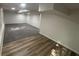 Spacious basement area with gray carpet and wood-look flooring, ready for customization and finishing at 600 Mary Erna Dr, Fairburn, GA 30213