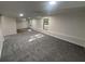 The finished basement has neutral walls, recessed lighting, and plush gray carpeting at 600 Mary Erna Dr, Fairburn, GA 30213