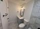 Bathroom featuring a grey vanity, black fixtures, and tile accents around the room at 600 Mary Erna Dr, Fairburn, GA 30213