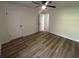 Well-lit bedroom with neutral walls, closet, and modern light-colored flooring at 600 Mary Erna Dr, Fairburn, GA 30213