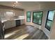 Modern kitchen with ample natural light, sleek countertops, subway tile backsplash, and stainless appliances at 600 Mary Erna Dr, Fairburn, GA 30213
