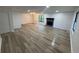 Spacious living room with modern laminate floors, cozy fireplace, fresh paint, and natural light at 600 Mary Erna Dr, Fairburn, GA 30213