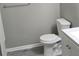 Modern bathroom features a toilet, vanity with storage, and gray floors at 6354 Shannon Pkwy # 20D, Union City, GA 30291