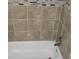 Bathroom tiled tub surround with a tub and tile accent at 6354 Shannon Pkwy # 20D, Union City, GA 30291