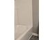 Clean white bathtub with bright white brick-patterned tile surround at 6354 Shannon Pkwy # 20D, Union City, GA 30291
