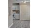 A view of the kitchen and flooring, including white cabinets, counters and appliances at 6354 Shannon Pkwy # 20D, Union City, GA 30291