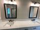 Bathroom featuring double vanity, quartz countertop, and a framed mirror at 6861 Ga Hwy 5, Douglasville, GA 30135