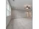 Expansive bonus room featuring soft carpet, light gray walls, and plenty of natural light at 6861 Ga Hwy 5, Douglasville, GA 30135