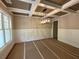 Dining room with coffered ceilings, modern chandelier, and wainscoting at 6861 Ga Hwy 5, Douglasville, GA 30135