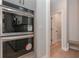 A view of a double oven appliance with a view of an additional room off of the kitchen at 6861 Ga Hwy 5, Douglasville, GA 30135