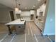 Modern kitchen featuring white cabinets, quartz countertops, and a large island at 6861 Ga Hwy 5, Douglasville, GA 30135