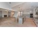 Open-concept kitchen featuring a large island with pendant lighting and a view of the living area with a fireplace at 6861 Ga Hwy 5, Douglasville, GA 30135