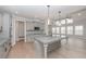 Spacious kitchen featuring a large island with pendant lighting and a view of a room with lots of natural light at 6861 Ga Hwy 5, Douglasville, GA 30135