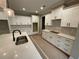 Modern kitchen featuring white cabinets, quartz countertops, and stainless steel appliances at 6861 Ga Hwy 5, Douglasville, GA 30135