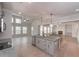 Open-concept kitchen featuring a large island with pendant lighting and a view of the living area with a fireplace at 6861 Ga Hwy 5, Douglasville, GA 30135