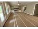Large, open living room featuring a modern fireplace, built-in shelving, and large windows at 6861 Ga Hwy 5, Douglasville, GA 30135