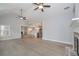 Open-concept living room with fireplace, vaulted ceiling, and hardwood floors at 6861 Ga Hwy 5, Douglasville, GA 30135