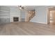 Bright living room featuring a fireplace with built-in shelving and large windows for natural light at 6861 Ga Hwy 5, Douglasville, GA 30135