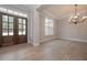 Inviting living room with hardwood floors, a modern chandelier, and grand entrance at 6861 Ga Hwy 5, Douglasville, GA 30135
