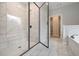 Luxurious main bathroom featuring a glass enclosed shower, a soaking tub, and tile flooring at 6861 Ga Hwy 5, Douglasville, GA 30135