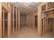 The unfinished basement with framed walls, concrete flooring and ceiling insulation presents a blank canvas for future living space at 6861 Ga Hwy 5, Douglasville, GA 30135