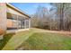 Picture of the home's backyard featuring a screened porch and lush landscaping at 3257 Alhambra Cir, Hampton, GA 30228