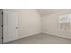 Cozy bedroom with a window, neutral walls, and plush carpeting at 3257 Alhambra Cir, Hampton, GA 30228