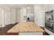 Kitchen island with granite countertop, stainless steel refrigerator and double ovens at 3257 Alhambra Cir, Hampton, GA 30228