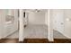 A spacious carpeted living room with large windows and a stone fireplace at 3257 Alhambra Cir, Hampton, GA 30228