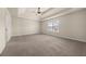 Spacious main bedroom with tray ceiling, neutral walls, and window offering natural light at 3257 Alhambra Cir, Hampton, GA 30228