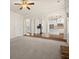 Open floor plan with hardwood floors and a view into a gourmet kitchen at 3257 Alhambra Cir, Hampton, GA 30228