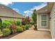 Charming backyard featuring a brick paver patio and lush landscaping at 3538 Serenade Nw Commons, Kennesaw, GA 30152