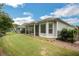 A well-manicured lawn and garden provide a beautiful backyard setting with a screened in porch at 3538 Serenade Nw Commons, Kennesaw, GA 30152