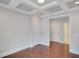 Bedroom boasting a tray ceiling, wood floors, and bright, white trim at 3538 Serenade Nw Commons, Kennesaw, GA 30152