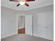Bright bedroom featuring neutral walls, carpet flooring, and closet space at 3538 Serenade Nw Commons, Kennesaw, GA 30152