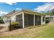 Well-maintained backyard boasts a screened porch, manicured lawn and decorative black fencing at 3538 Serenade Nw Commons, Kennesaw, GA 30152