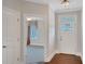 Inviting foyer featuring hardwood floors and a white front door with glass panel at 3538 Serenade Nw Commons, Kennesaw, GA 30152